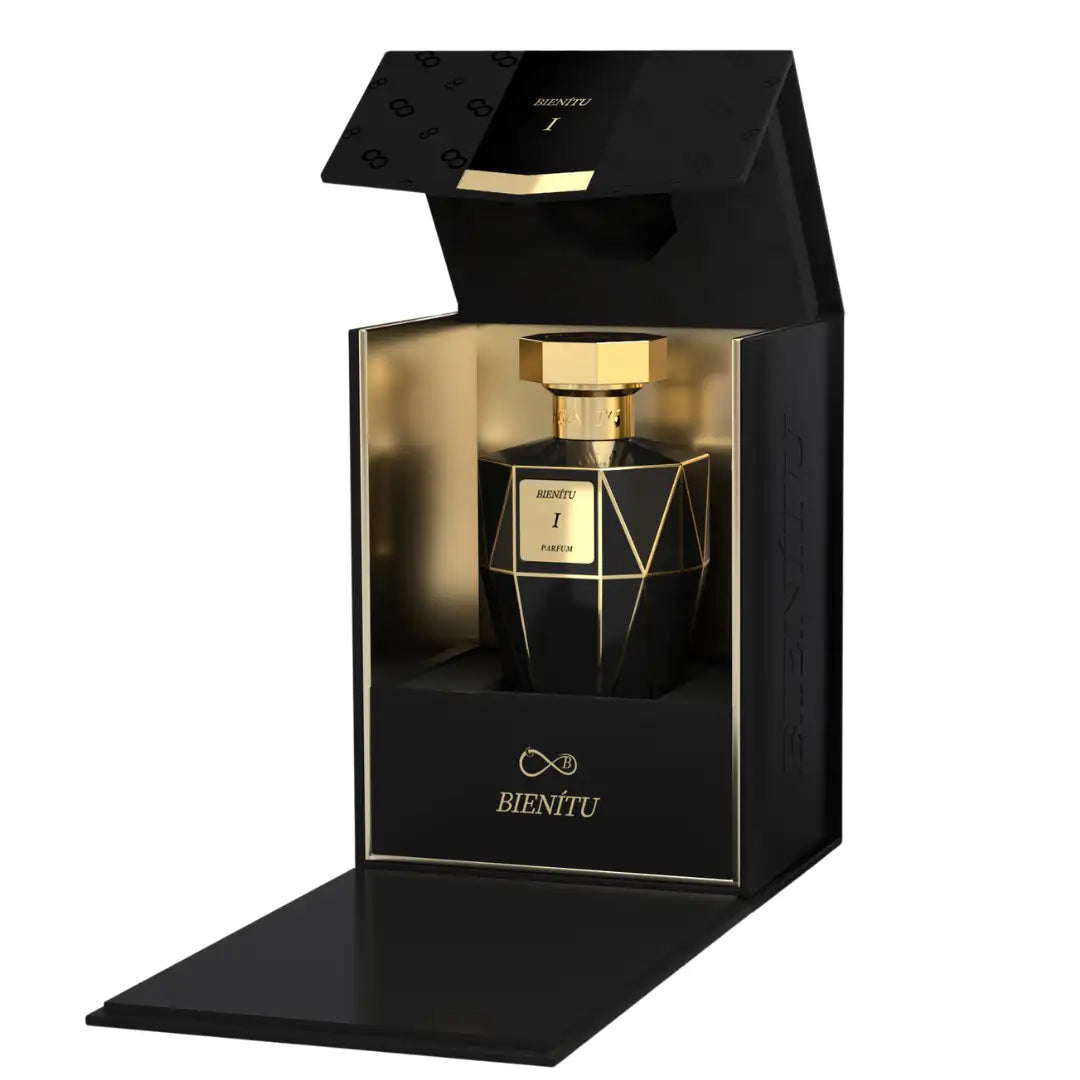 Black geometric perfume bottle with gold accents and a hexagonal cap, presented in an elegant black box.