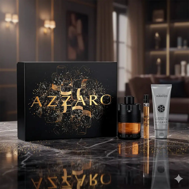 Black and gold azzaro wanted men’s grooming set featuring a matte black bottle with amber liquid, a slender golden spray vial, and a silver tube of body lotion.