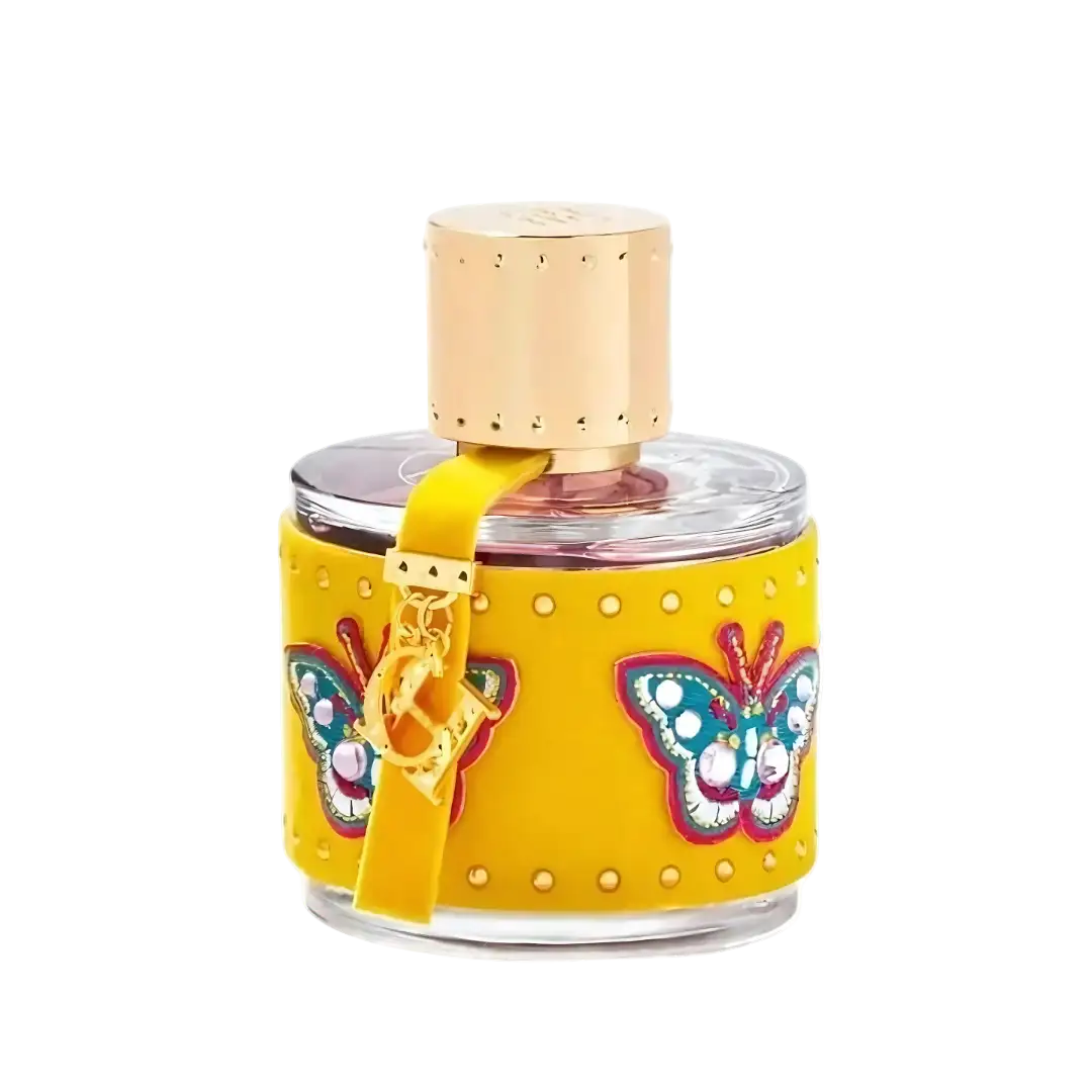 A vibrant yellow perfume bottle with a clear glass body, adorned with colorful butterfly appliqués and gold-tone studs, topped with a metallic cap.